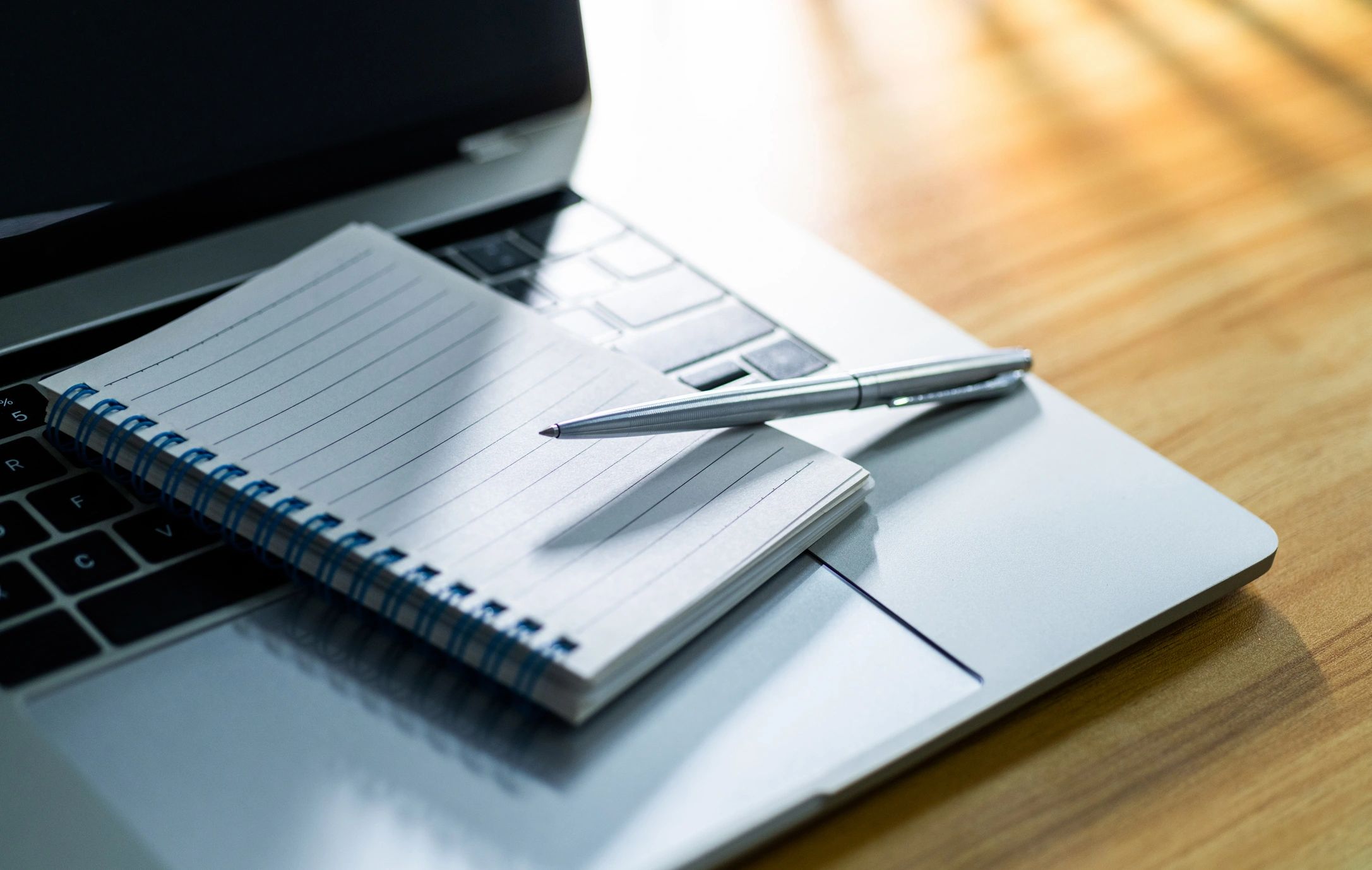 Laptop and notebook prepared for resume writing